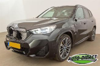 skadebil auto BMW iX1 eDrive20 67 kWh Automaat 54.836 km Pano Digi Dash Clima 2023/12