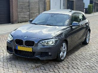 Damaged car BMW 1-serie 120d M PAKKET AUTOMAAT 2014/1
